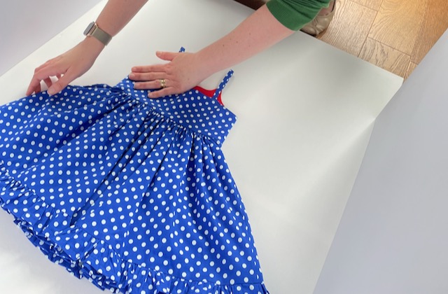 Girls Blue Summer Dress being prepared for photography